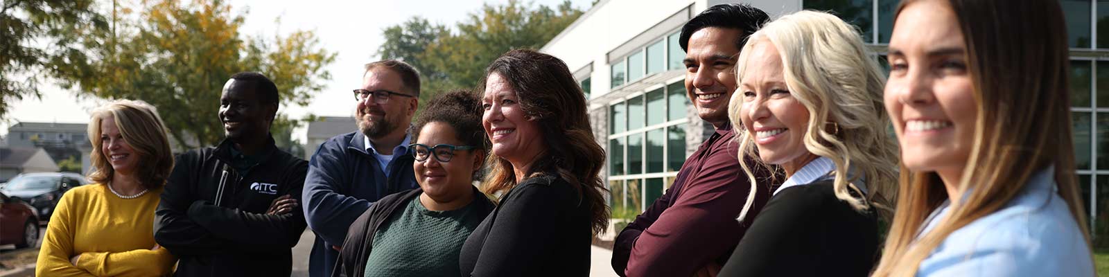 A group of employees smile